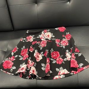 Black and red/pink floral skirt; brand: XXI; size xs; undershorts not present